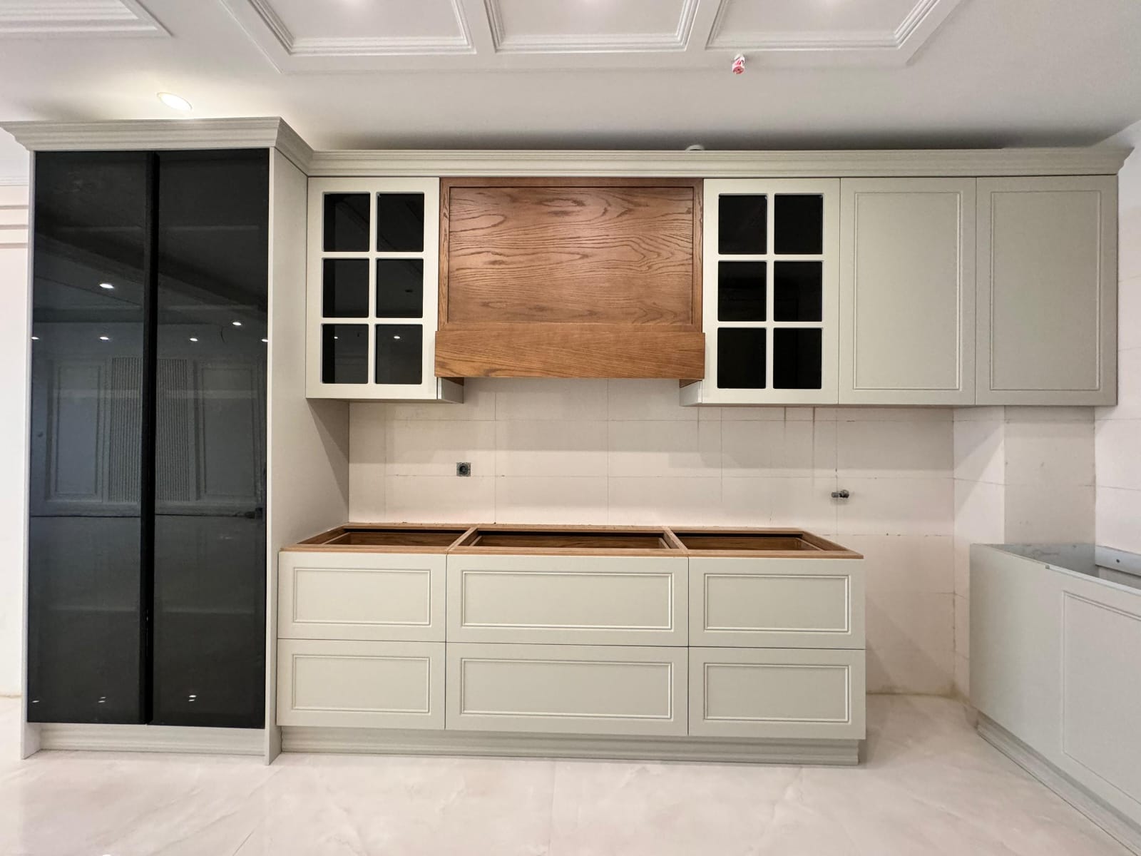 Completed modern  and minimal kitchen renovation with white cabinets and wooden details