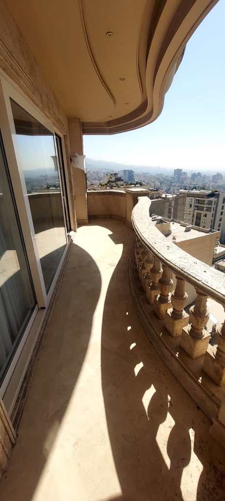 Empty balcony before renovation, showing original concrete flooring