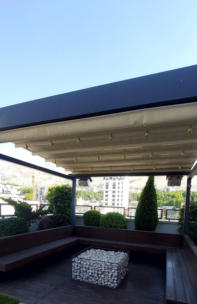 Modern balcony design in the Netherlands with wooden seating, decorative stones, and greenery for outdoor living