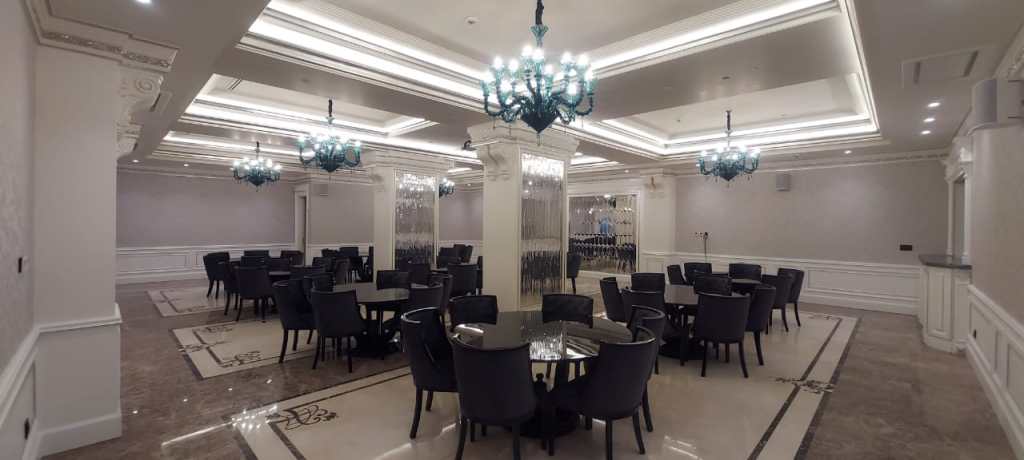 Spacious lobby hall designed for social gatherings and meetings, with luxurious ceiling chandeliers